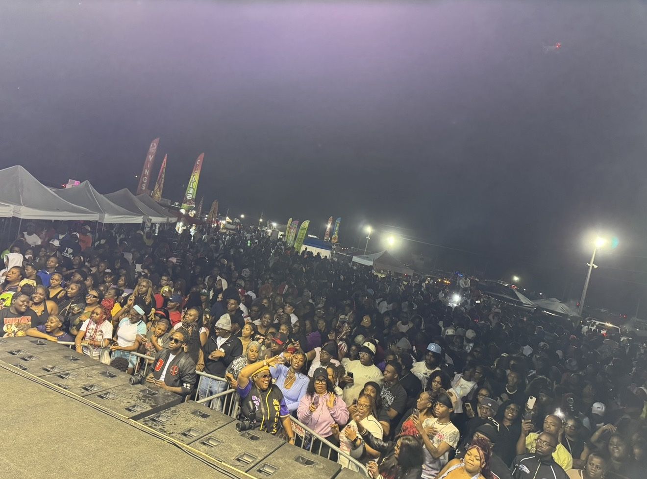 Packed outdoor night crowd at a TeamMTS event